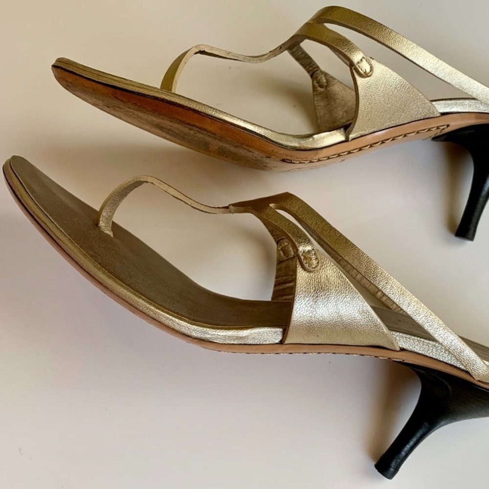 Costume National slip on gold leather mules.